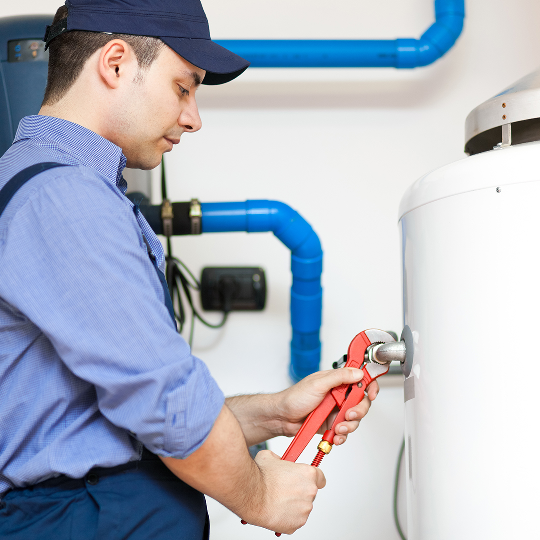 plumber working on plumbing