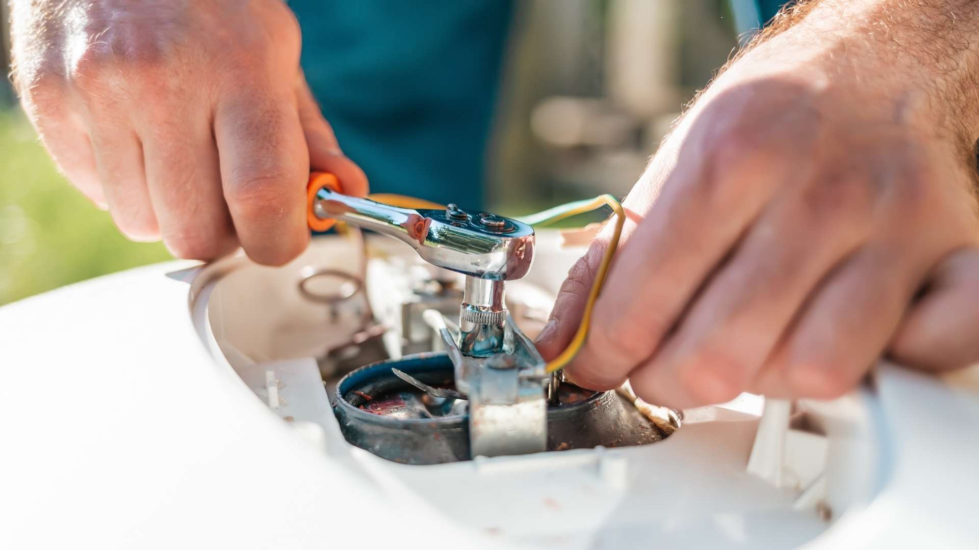 Water heater repairman fixing water heater