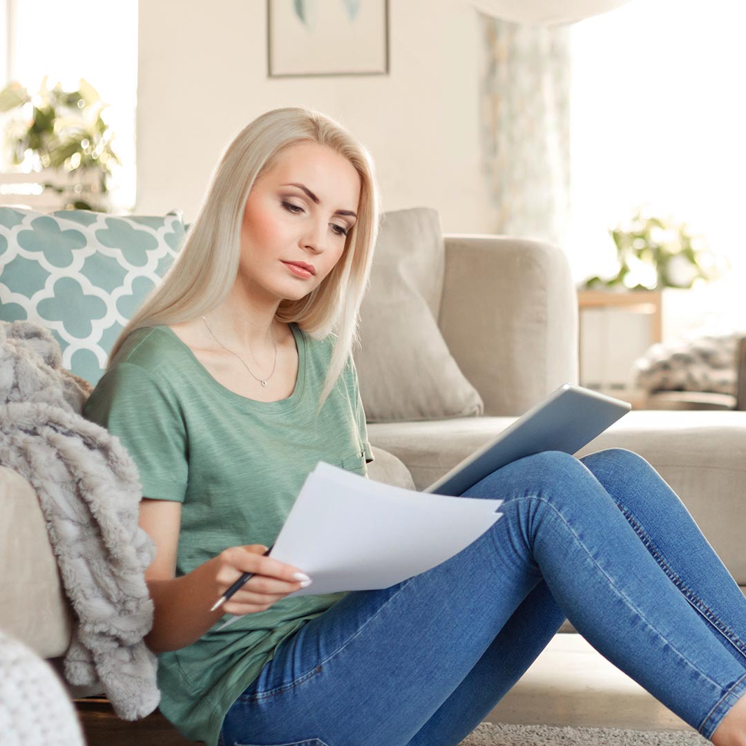 woman looking over her water bill
