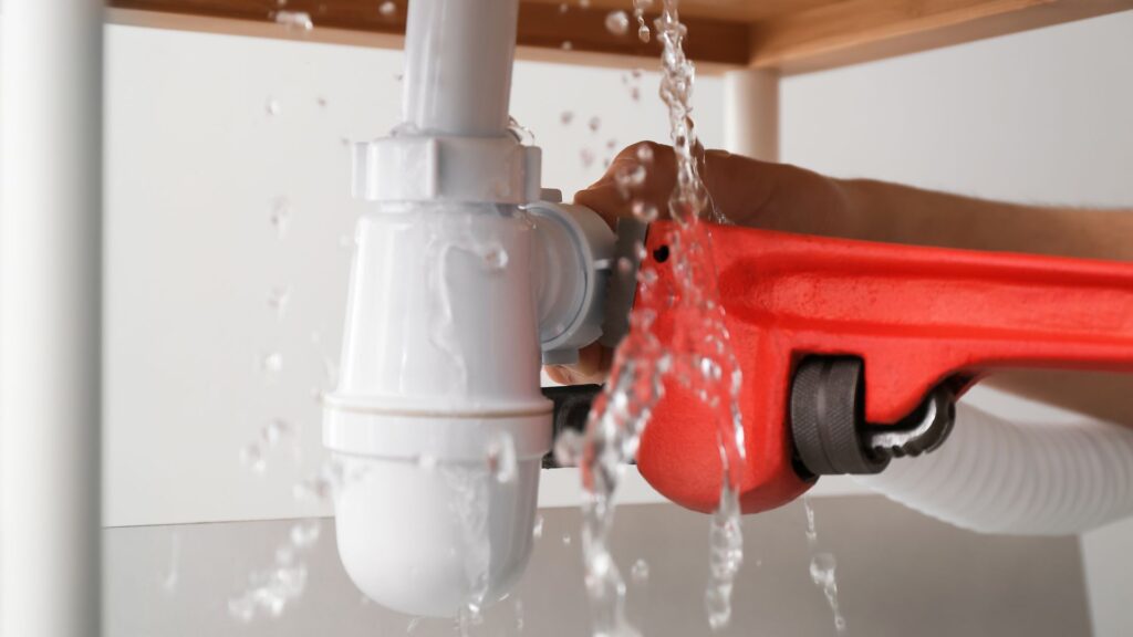 plumber fixing sink fixture