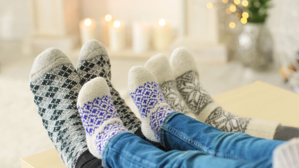 Family wearing cozy socks indoors