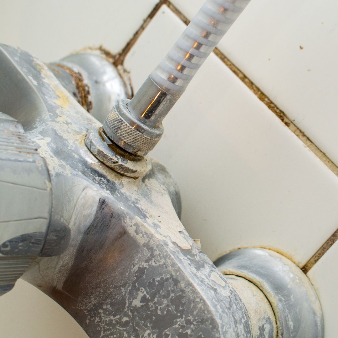 faucet controls with hard water stains