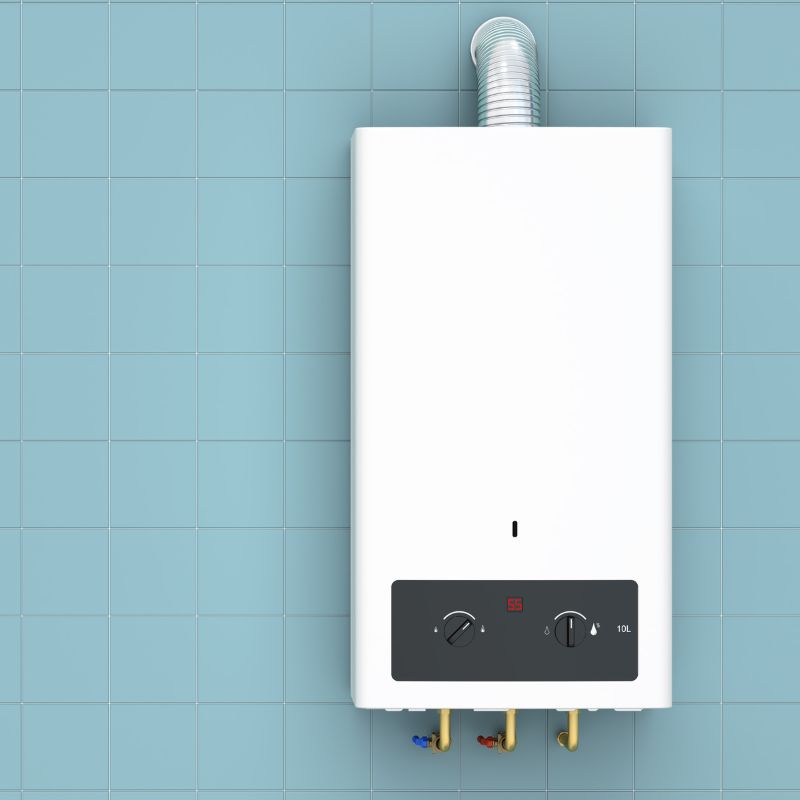 a tankless water heater on a tile wall