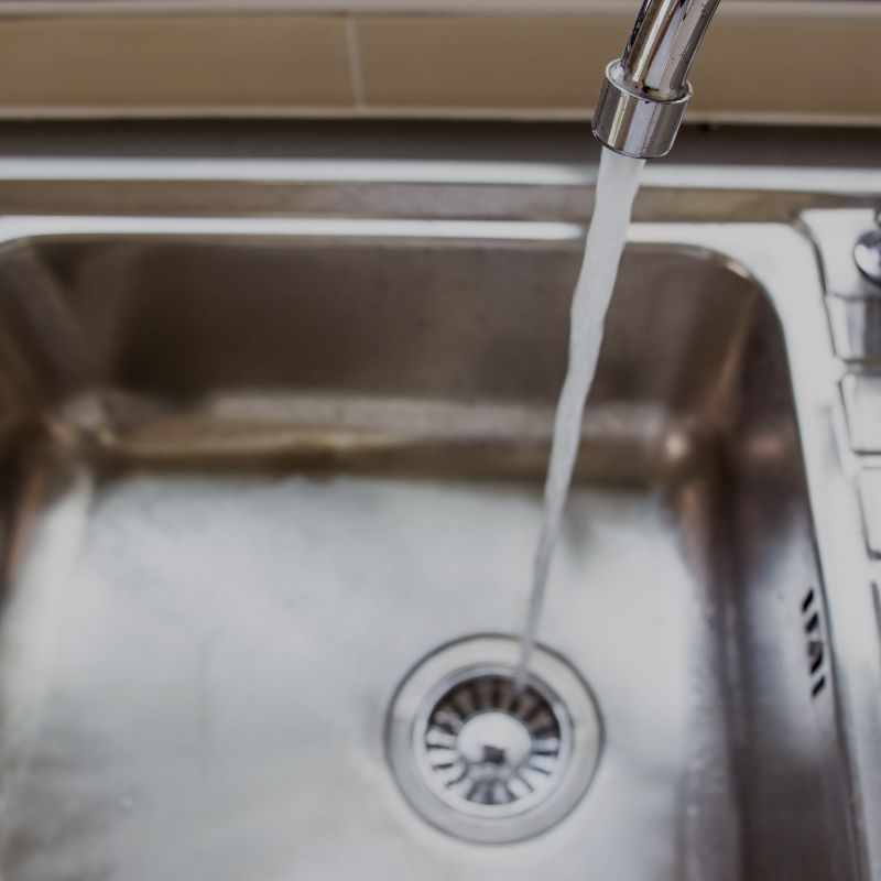 A sink flowing into the sink basin
