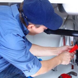 Plumber repairing sink